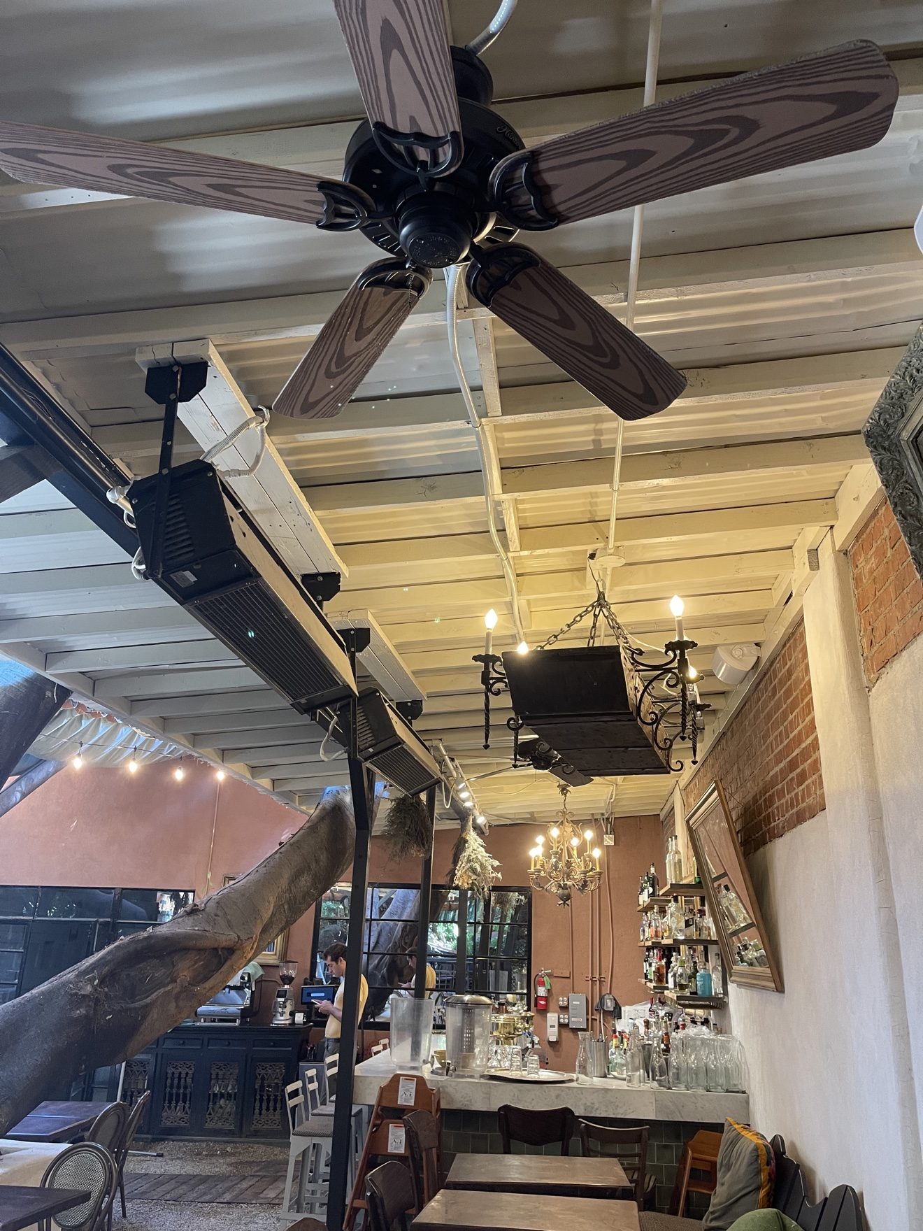 Ceiling-mounted patio heaters in a restaurant interior